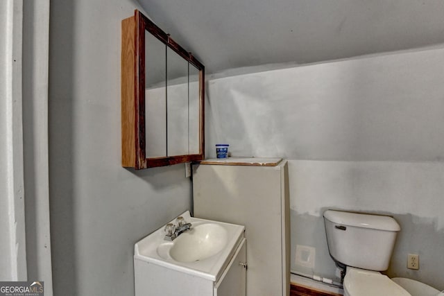 3615 Miller Bottom Rd, Loganville, GA 30052 - bathroom with vanity, lofted ceiling, and toilet