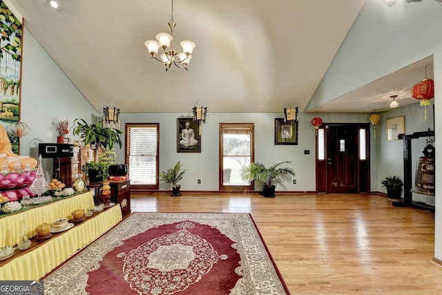3615 Miller Bottom Rd, Loganville, GA 30052 - foyer featuring a chandelier, wood-type flooring, and lofted ceiling