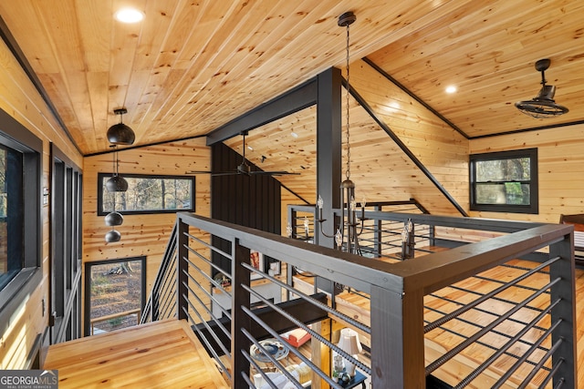 73 Cannon St, Clayton, GA 30525 - corridor with wooden ceiling, wooden walls, vaulted ceiling, an upstairs landing, and wood finished floors