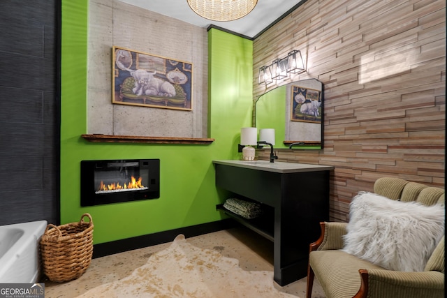 73 Cannon St, Clayton, GA 30525 - full bath with a glass covered fireplace, concrete flooring, vanity, and a tub