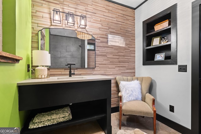 sitting room featuring built in shelves and sink