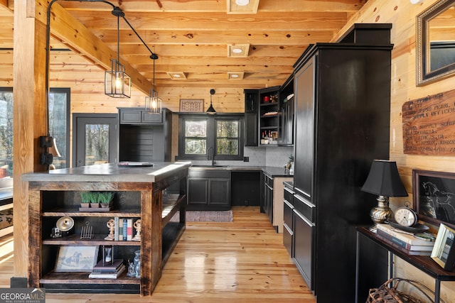 73 Cannon St, Clayton, GA 30525 - kitchen with open shelves, wood walls, a sink, plenty of natural light, and light wood finished floors