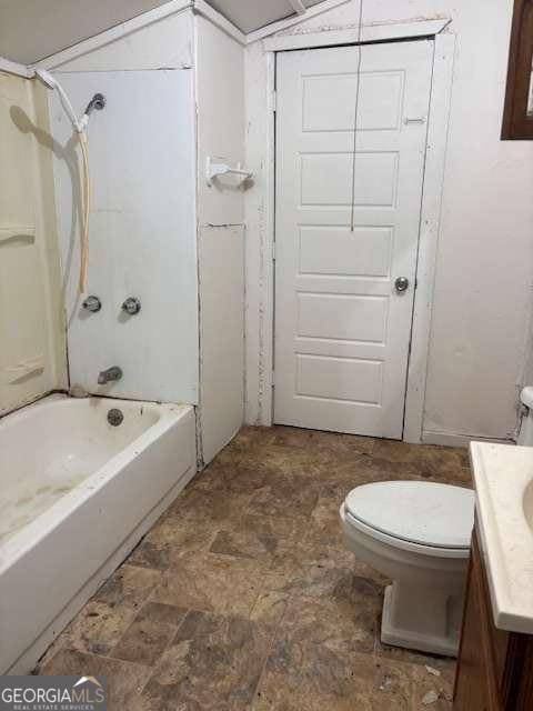 161 Cotton St, Commerce, GA 30529 - full bathroom featuring toilet, vanity, and washtub / shower combination