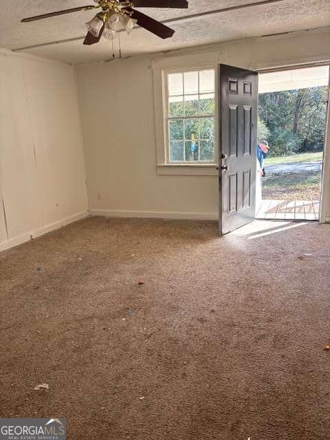 161 Cotton St, Commerce, GA 30529 - entryway with carpet, a textured ceiling, and ceiling fan