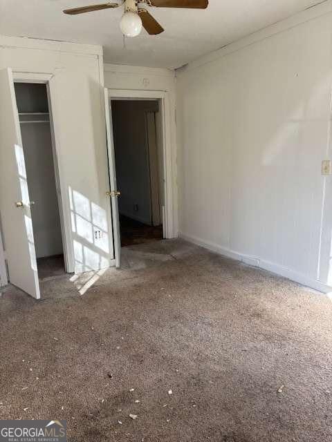 161 Cotton St, Commerce, GA 30529 - unfurnished bedroom featuring carpet, a closet, ceiling fan, and ornamental molding