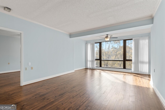 spare room with crown molding, dark hardwood / wood-style flooring, ceiling fan, and a textured ceiling