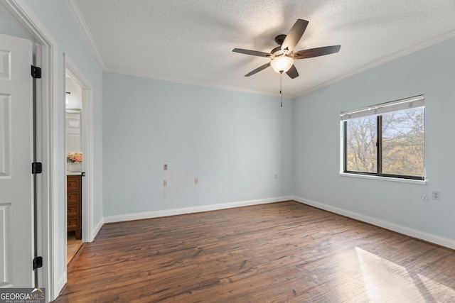 unfurnished room with a textured ceiling, ceiling fan, ornamental molding, and dark wood-type flooring