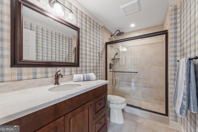 bathroom featuring an enclosed shower, vanity, a textured ceiling, crown molding, and toilet