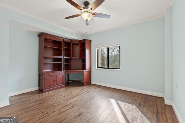 interior space featuring hardwood / wood-style floors, a textured ceiling, ceiling fan, and ornamental molding