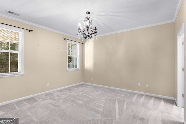 spare room with light colored carpet, an inviting chandelier, and crown molding