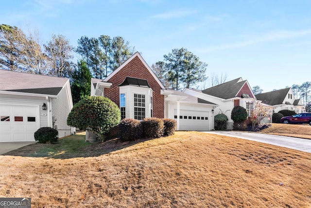 view of front of house featuring a front yard and a garage