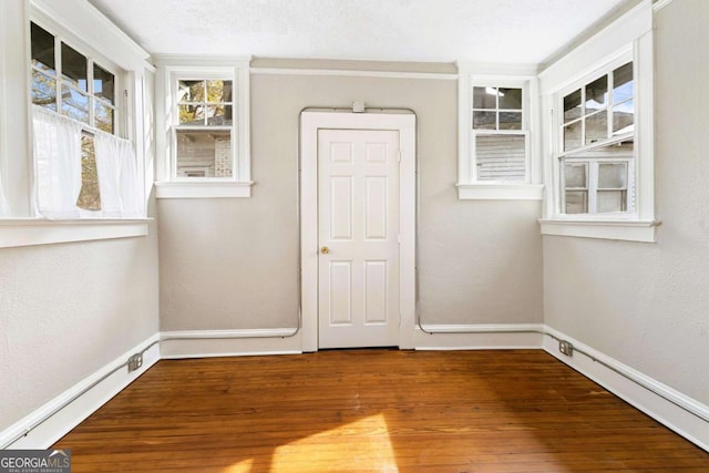 spare room with wood-type flooring