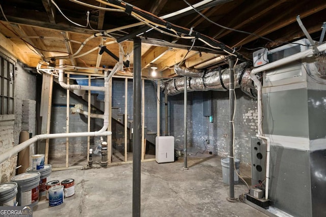 basement featuring heating unit