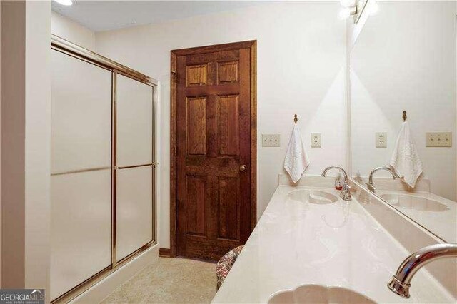 bathroom featuring vanity and walk in shower