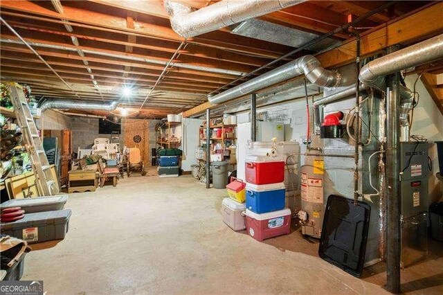 basement with heating unit and gas water heater