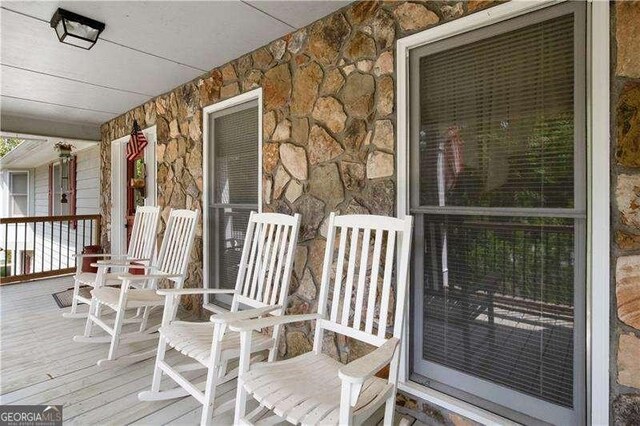 wooden deck with a porch