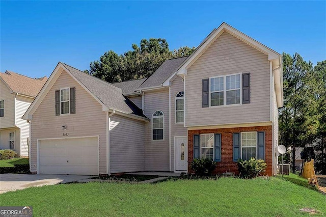 view of front property with a front yard and a garage