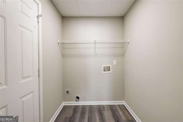 laundry area featuring hookup for a washing machine, dark hardwood / wood-style floors, and electric dryer hookup