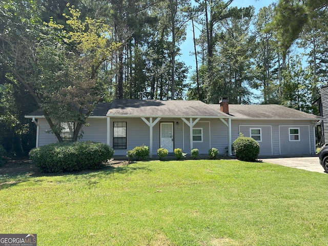 single story home with covered porch and a front lawn