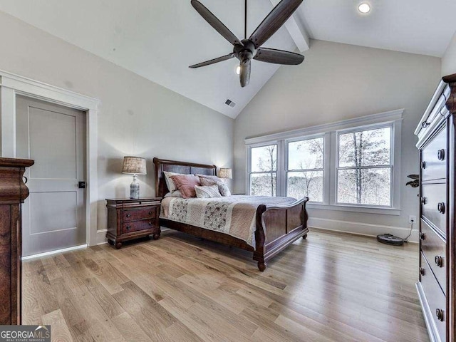 bedroom with beamed ceiling, light hardwood / wood-style floors, high vaulted ceiling, and ceiling fan