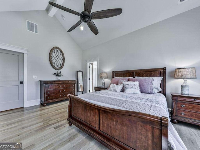 bedroom with ceiling fan, beamed ceiling, high vaulted ceiling, and light wood-type flooring