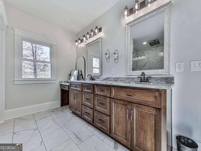 bathroom featuring vanity and tiled shower