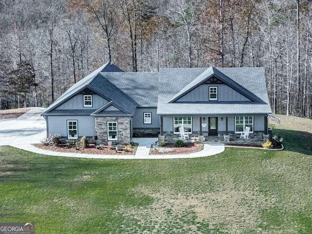 rear view of house with a yard