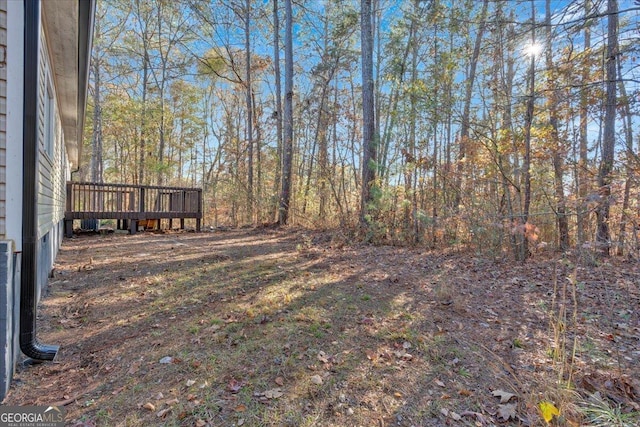 view of yard featuring a wooden deck