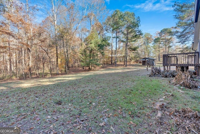 view of yard featuring a wooden deck