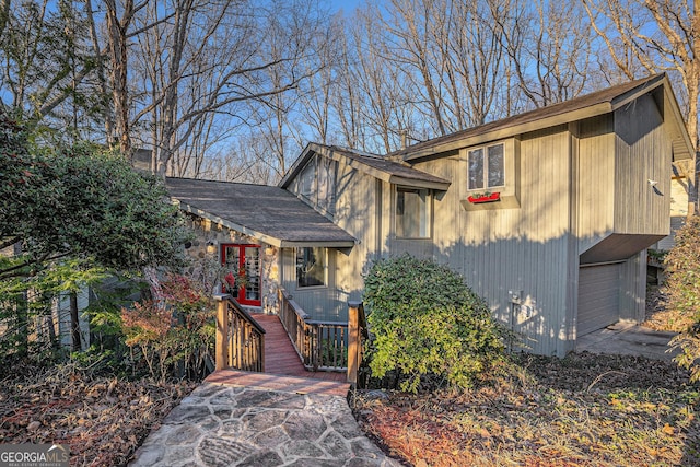 view of front facade featuring an attached garage and french doors