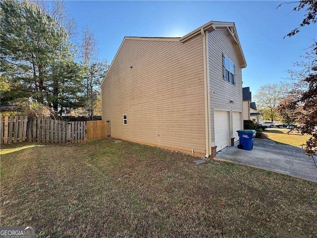 view of property exterior with a lawn and a garage