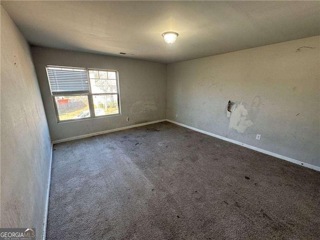 unfurnished room with carpet floors