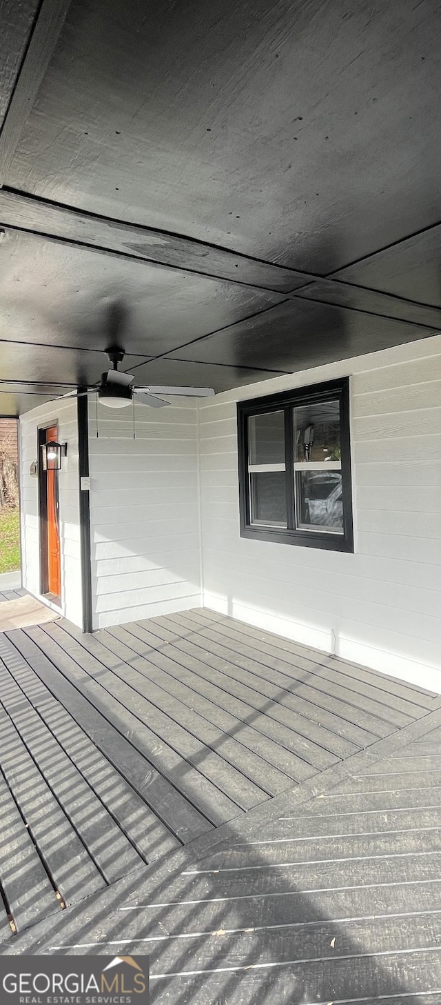 wooden deck with ceiling fan