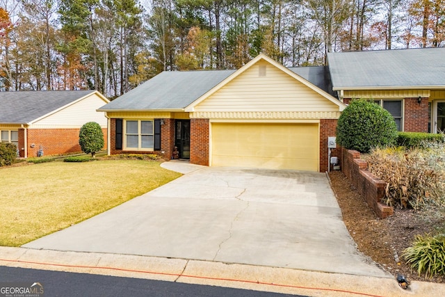 single story home with a garage and a front lawn