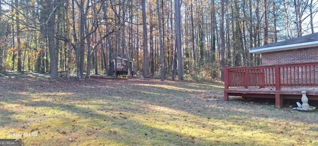 view of yard with a wooden deck