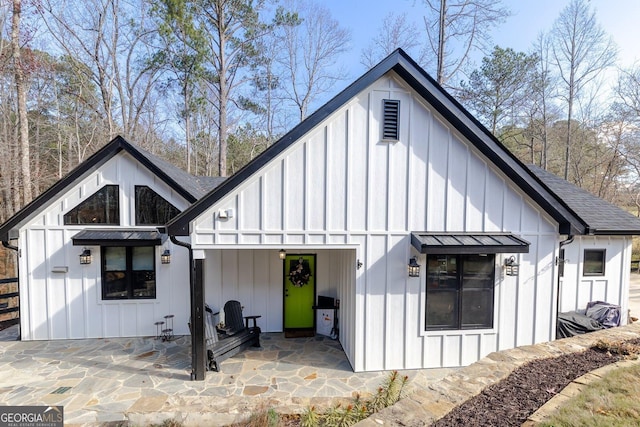 back of property featuring a patio