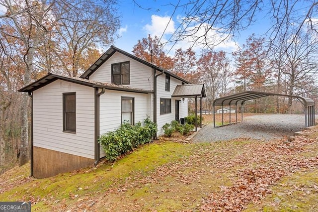 view of side of home featuring a carport