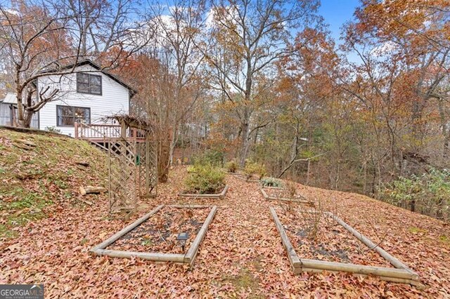 view of yard featuring a wooden deck