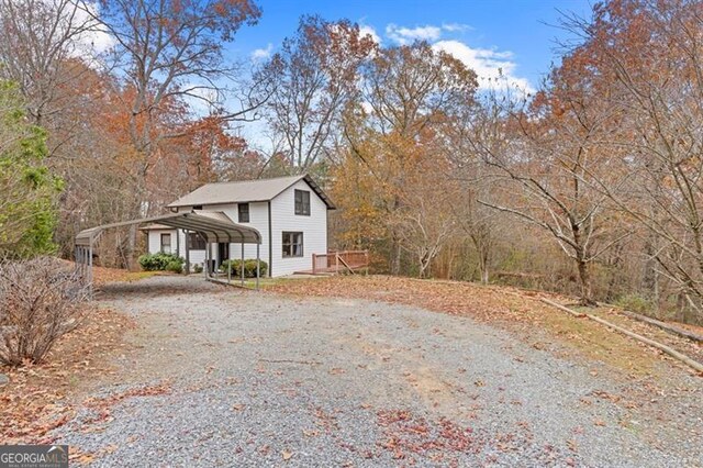 view of home's exterior with a carport