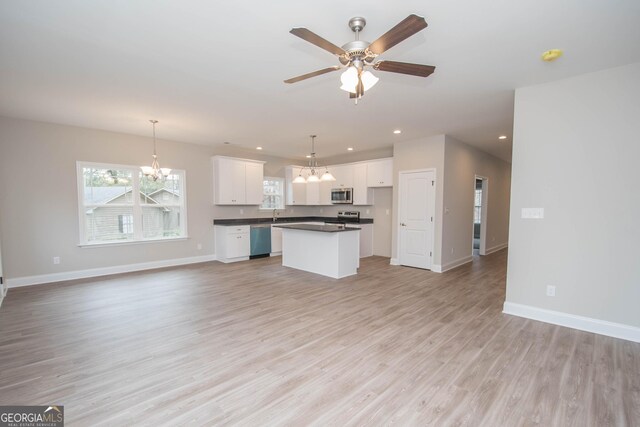 clothes washing area featuring washer hookup, electric dryer hookup, and light hardwood / wood-style flooring