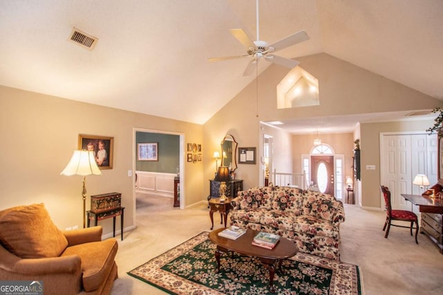 carpeted living room featuring high vaulted ceiling and ceiling fan