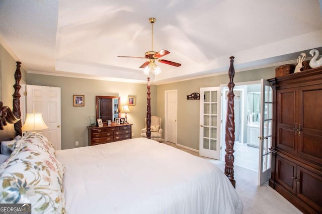 bedroom with light carpet, french doors, a raised ceiling, and ceiling fan