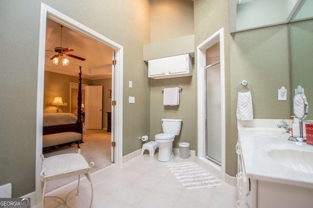 bathroom featuring ceiling fan, sink, and a shower with door