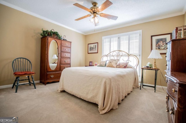 bedroom featuring ceiling fan, crown molding, and light carpet