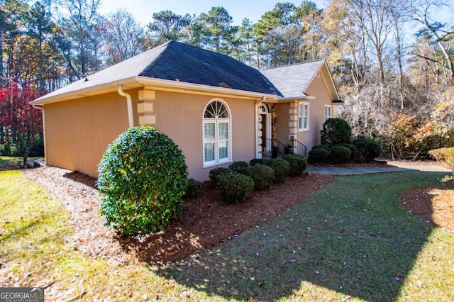 view of home's exterior featuring a lawn