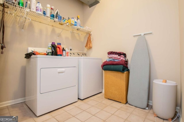 washroom featuring light tile patterned flooring and independent washer and dryer