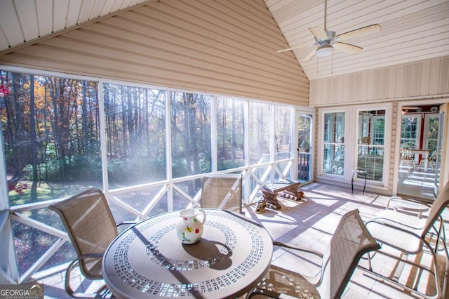 sunroom featuring ceiling fan and lofted ceiling