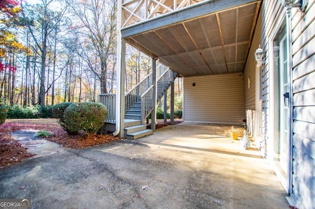 view of parking / parking lot featuring a carport