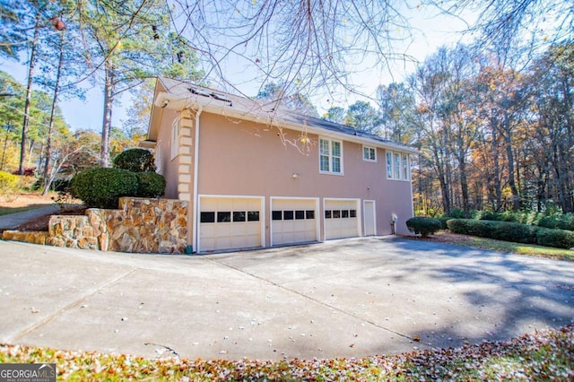 view of side of property featuring a garage