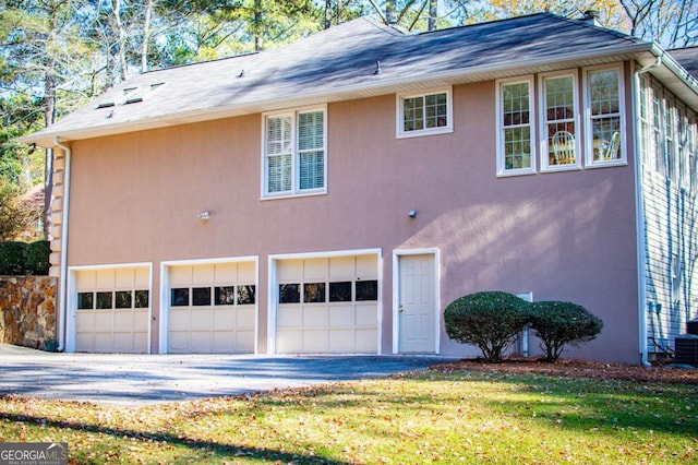 view of side of property featuring a garage